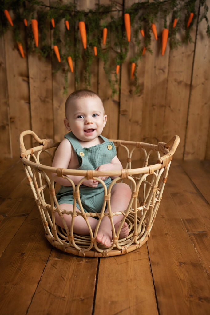 Easter Mini Session happy baby in basket carrot garland